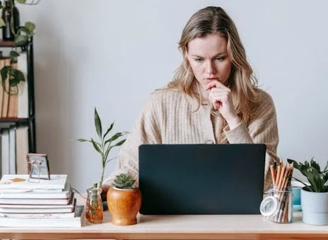 Focused woman working on digital marketing